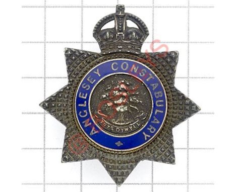 Welsh. Anglesey Constabulary pre 1950 Senior Police Officer’s silver cap badge Die-cast silver and blue enamel crowned star s