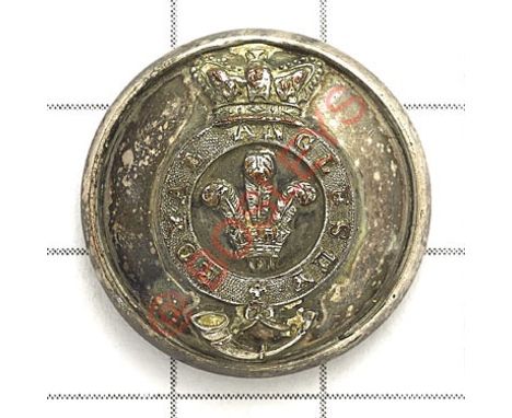 Welsh. Royal Anglesey Militia Officer’s silvered closed back coatee button. Crowned strap over strung bugle; central Prince o