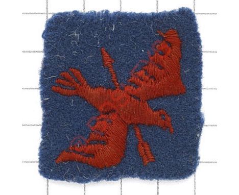 Badge. 1st Anti-Aircraft Corps scarce WW2 embroidered formation sign. Red bird pierced by an arrow on blue felt square. HQ Hi