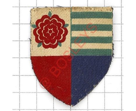 Badge. 100th AGRA (Army Group Royal Artillery) formation sign. Printed shield quartered with Hampshire Rose, green lines from