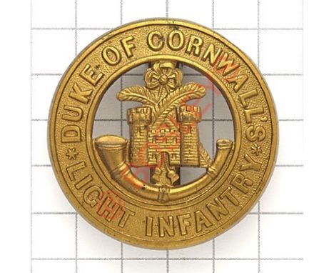 Duke of Cornwall’s Light Infantry post 1881 brass pagri badge. Die-stamped. VGC Long slider (clipped) 