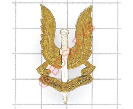 Special Air Service Officer’s SAS cap badge. Die-cast silvered dagger, the wings and “Who Dares Wins” scroll in gilt. Designe
