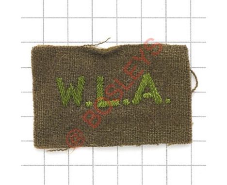 Badge. W.L.A. scarce Womens Land Army embroidered shoulder title. Green on khaki rectangle VGC 