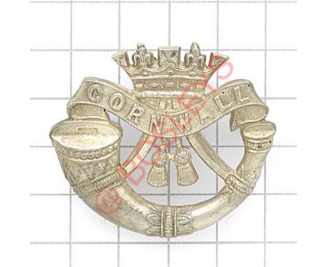 Duke of Cornwall’s Light Infantry Officer’s silvered cap badge. Die-cast strung bugle surmounted by the Coronet resting on a 