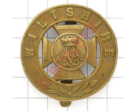 Wiltshire Regiment post 1881 brass pagri badge. Die-stamped. GC Long slider shortened 