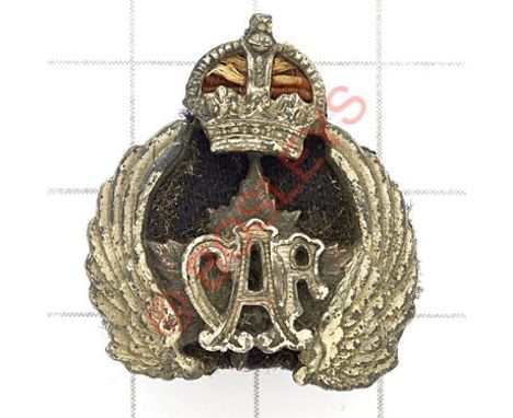 Canadian Air Force Officer’s 1st pattern 1920’s collar badge. Die-stamped silvered crowned wing maple leaf, applied ‘CAF’ to 