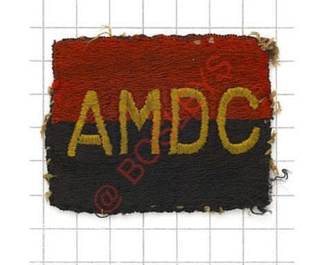 Badge. Army Mechanised Demonstration Column formation sign. Yellow AMDC embroidered on red over black embroidered rectangle. 