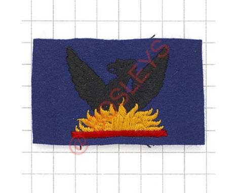 Badge. 87th AGRA (Army Group Royal Artillery) embroidered formation sign. Black Phoenix rising from yellow flames on blue rec