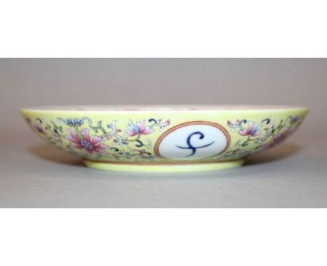A CHINESE FAMILLE ROSE PORCELAIN DISH, the interior decorated in iron-red with bats encircling a central Shou medallion, the 