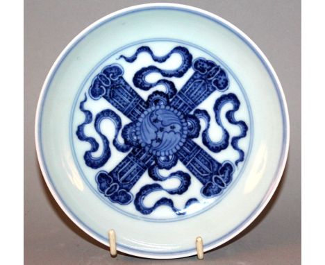 A CHINESE BLUE & WHITE PORCELAIN DISH, unusually decorated to its centre with a double ruyi vajra, the base with a six-charac