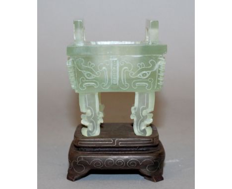A SMALL 20TH CENTURY CHINESE CELADON JADE-LIKE CENSER, together with a fitted wire-inlaid wood stand, the censer of archaic f
