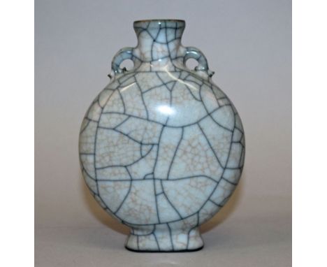 A GE TYPE CHINESE CRACKLEGLAZE PORCELAIN MOON FLASK, with grey and brownish crackles, 6.1in high.