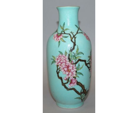 A CHINESE TURQUOISE GROUND FAMILLE ROSE PORCELAIN VASE, decorated with a blossoming branch reserved on an incised sgraffiato 