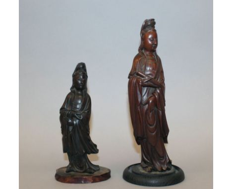 A GOOD QUALITY 19TH CENTURY CHINESE HARDWOOD CARVING OF GUANYIN, mounted on a fixed wood stand, her slightly curved body clad