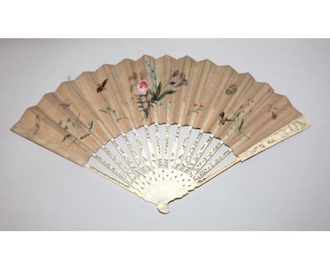 A 19TH CENTURY IVORY & PAINTED PAPER FAN, the ivory probably carved in Europe with a detailed scene to each of the guard stic