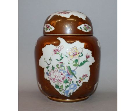 A CHINESE FAMILLE ROSE BATAVIAN STYLE PORCELAIN JAR & COVER, decorated with leaf-shaped floral and bird panels reserved on a 