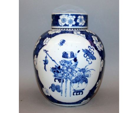 A LARGE 19TH CENTURY CHINESE BLUE & WHITE PORCELAIN JAR & COVER, painted with quatrefoil panels of precious objects, bronze-f