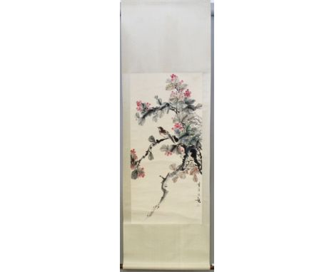 A 20TH CENTURY CHINESE HANGING SCROLL PAINTING, depicting a bird perched on a fruiting branch, on a patterned silk mount, the