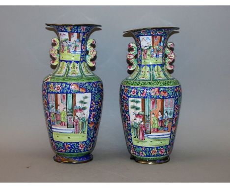 A PAIR OF 19TH/20TH CENTURY CHINESE CANTON ENAMEL VASES, each with panels of figural terrace scenes, 11.6in high.
