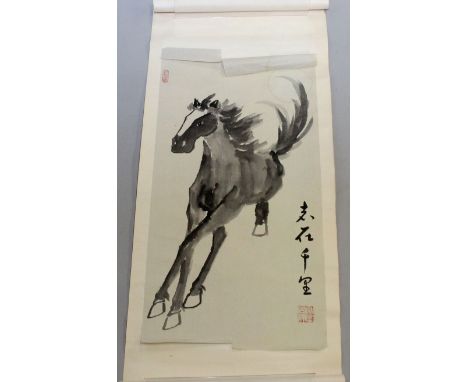 A 20TH CENTURY CHINESE SCROLL PAINTING ON PAPER, depicting a gambolling pony, contained in a patterned silk box, the painting