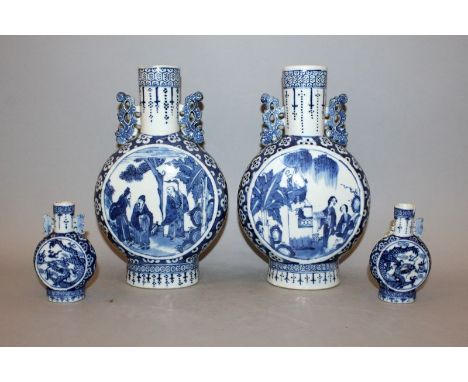 A PAIR OF 19TH CENTURY CHINESE BLUE & WHITE PORCELAIN MOON FLASKS, one flask painted with panels of a scene from a tale, the 