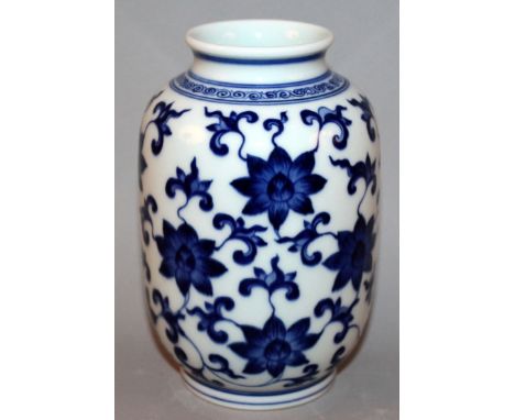 A CHINESE BLUE & WHITE PORCELAIN VASE, the sides decorated with an overall design of scroll-stemmed lotus, the base with a si