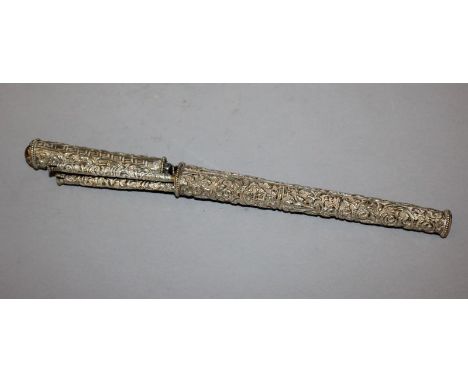 A 20TH CENTURY CHINESE EMBOSSED SILVER-METAL KNIFE & CHOPSTICK SET, decorated with dragons and scrolling foliage, 11.75in lon