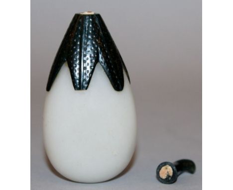 A CHINESE WHITE JADE-LIKE SNUFF BOTTLE & STOPPER, in the form of a gourd with onlaid leaves to the neck, 2.75in high.