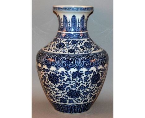 A LARGE CHINESE BLUE & WHITE PORCELAIN MING-STYLE PORCELAIN VASE, the sides decorated in a heaped and piled effect with bands