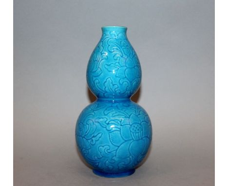 AN EARLY 20TH CENTURY CHINESE TURQUOISE GLAZED DOUBLE GOURD PORCELAIN VASE, incised beneath the glaze with leafy scroll-stemm