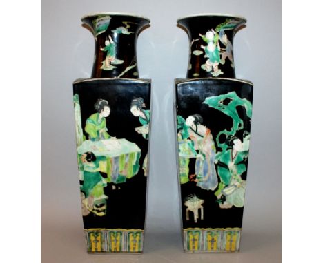 A LARGE PAIR OF CHINESE BLACK-GROUND FAMILLE VERTE PORCELAIN VASES, each flaring square-section body decorated with ladies in