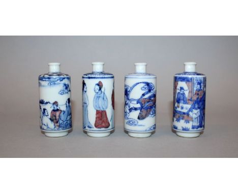 A GROUP OF FOUR SIMILAR CHINESE BLUE & WHITE AND COPPER-RED PORCELAIN SNUFF BOTTLES, with various designs, each 3.2in high. (