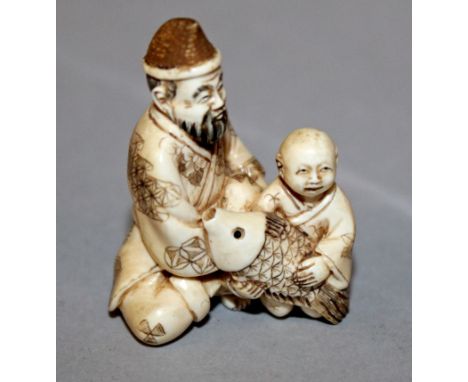 A SIGNED JAPANESE IVORY NETSUKE OF EBISU & KINTARO IN THE COMPANY OF A CARP, 1.4in high.