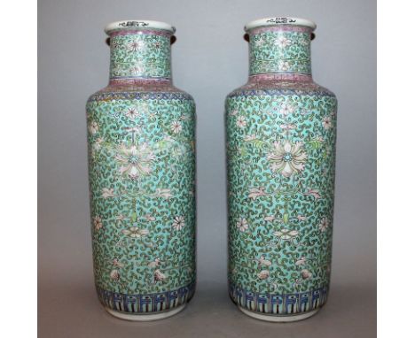 A PAIR OF 20TH CENTURY CHINESE TURQUOISE-GROUND ROULEAU PORCELAIN VASES, each decorated with a design of scroll-stemmed flowe