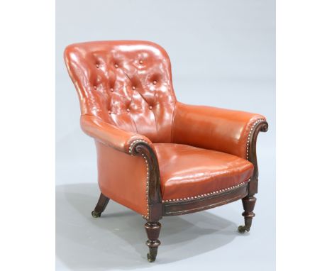 A 19TH CENTURY LEATHER UPHOLSTERED MAHOGANY LIBRARY CHAIR BY GILLOWS, with button back and out scrolled arms, raised on balus