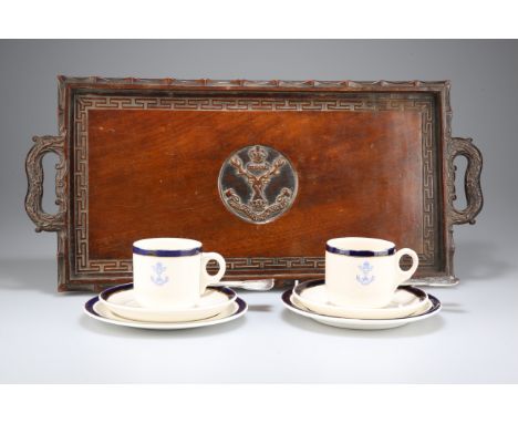 A FINELY CARVED RECTANGULAR WOODEN SERVING TRAY FEATURING THE BADGE OF THE GORDON HIGHLANDERS IN HIGH RELIEF, two pottery tea