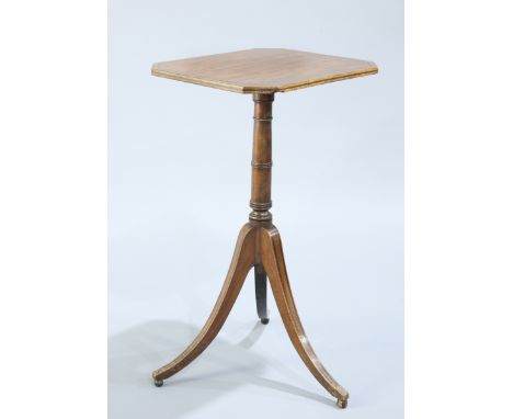 A REGENCY MAHOGANY TRIPOD TABLE, the rectangular top with cut-off corners raised on a ring turned tapering stem continuing to