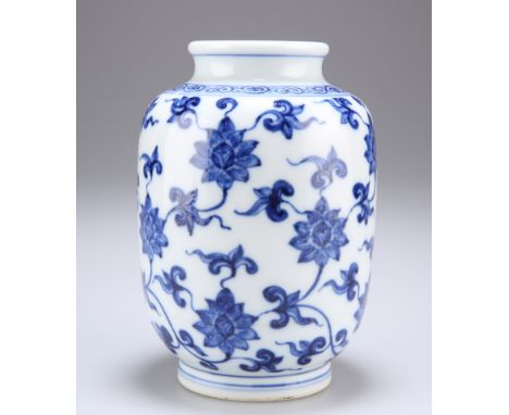 A CHINESE BLUE AND WHITE PORCELAIN VASE, baluster form with short neck, enamelled depicting a lotus meander beneath a scroll 