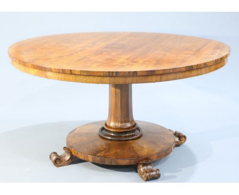 A REGENCY ROSEWOOD TILT-TOP BREAKFAST TABLE,&nbsp;the circular top raised on a tapering faceted stem issuing from a circular 