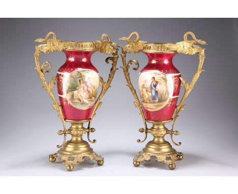 A PAIR OF 'VIENNA' GILT-METAL MOUNTED PORCELAIN VASES, CIRCA 1900,&nbsp;each painted with Classical figures within 'beaded' c
