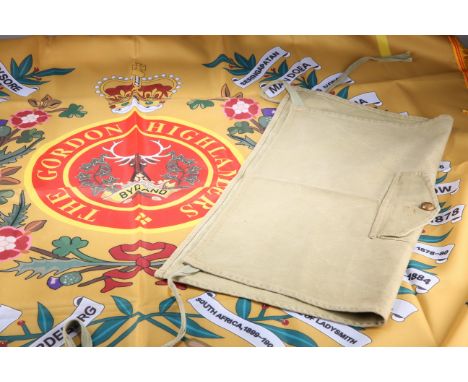 A POST 1952 GORDON HIGHLANDERS REGIMENTAL FLAG, and a kilt cover with front pocket and waist band (2)&nbsp;&nbsp;

The absenc