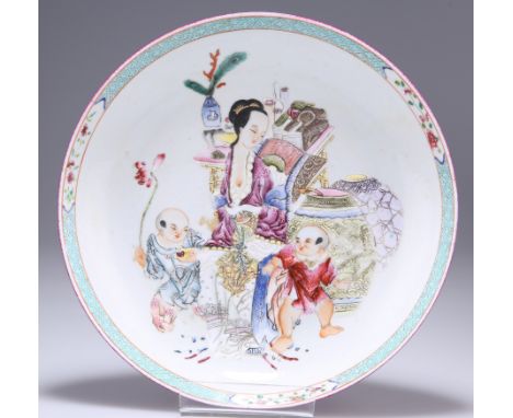 A CHINESE FAMILLE ROSE PORCELAIN DISH,&nbsp;circular, enamel painted in the characteristic palette with figures in an interio