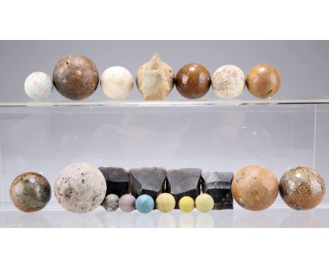 A QUANTITY OF PISTOL, MUSKET AND SMALL CALIBRE CANNON BALLS, together with several unused napped musket flints.  The absence 
