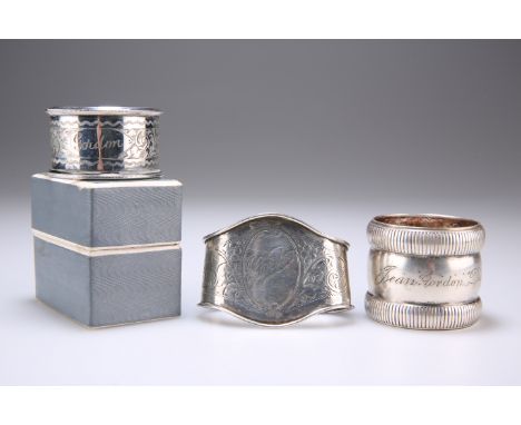 THREE NAPKIN RINGS, ONE HM, ONE UNMARKED, THE THIRD PLATED, the first Birmingham 1927, the second unmarked - both engraved 'G