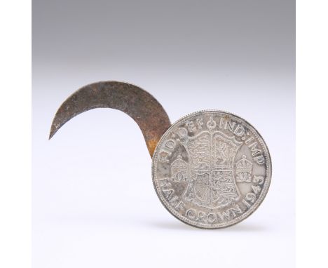 OF SOE INTEREST: A 1943 HALF-CROWN CONCEALING A SCYTHE-LIKE BLADE, pivoted and slotted in the rim of the coin of the type iss