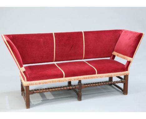 A 19TH CENTURY&nbsp;OAK AND UPHOLSTERED SETTEE IN&nbsp;17TH CENTURY STYLE ,&nbsp;the out-splayed ends raised on square sectio