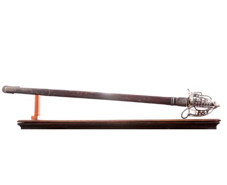 A STEEL HILT SCOTTISH SWORD WITH CEREMONIAL BASKET HILT, the blade double fullered and complete with its leather service dres