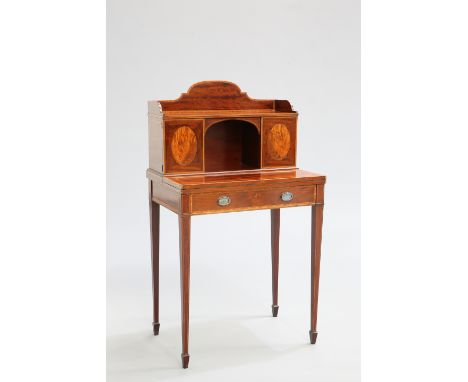 A FINE SATINWOOD BANDED MAHOGANY BONHEUR DU JOUR, the superstructure with a pair of cupboard doors flanking an arched recess,
