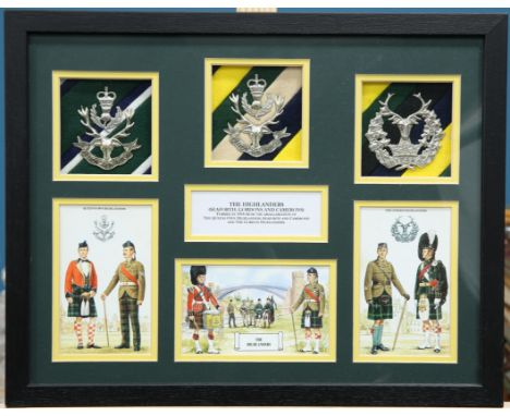A BOX FRAMED DISPLAY OF GLENGARRY BADGES AND IMAGES OF THE HIGHLANDERS AND ITS CONSTITUENT REGIMENTS, a framed Simkin print o