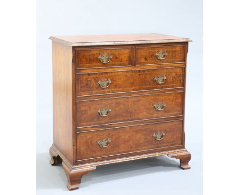 A GEORGE II STYLE BURR YEW CHEST OF DRAWERS, the half veneered moulded rectangular top with chevron inlay, over two short abo